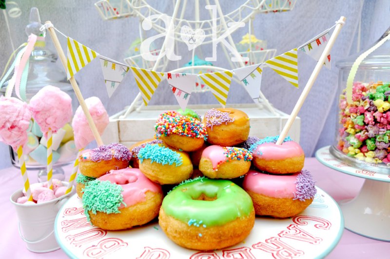 Pastel Carnival Party by A&K Lolly Buffet | Colourful iced donuts on Jaimie Oliver Tin Cake Stand